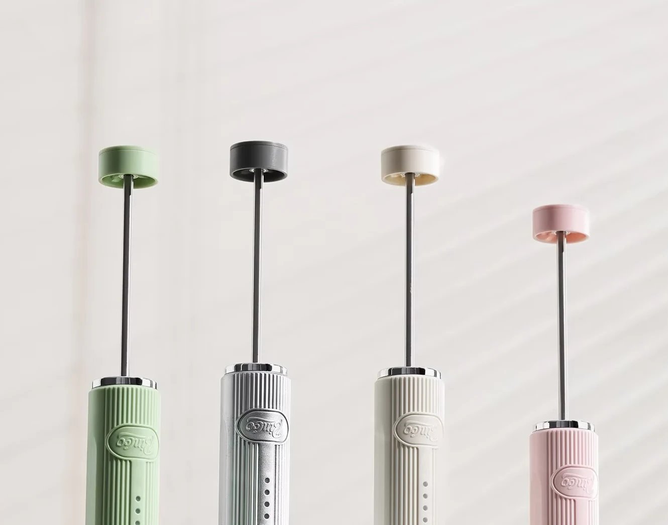 Seller photo showing Bincoo handheld milk frothers in multiple color options